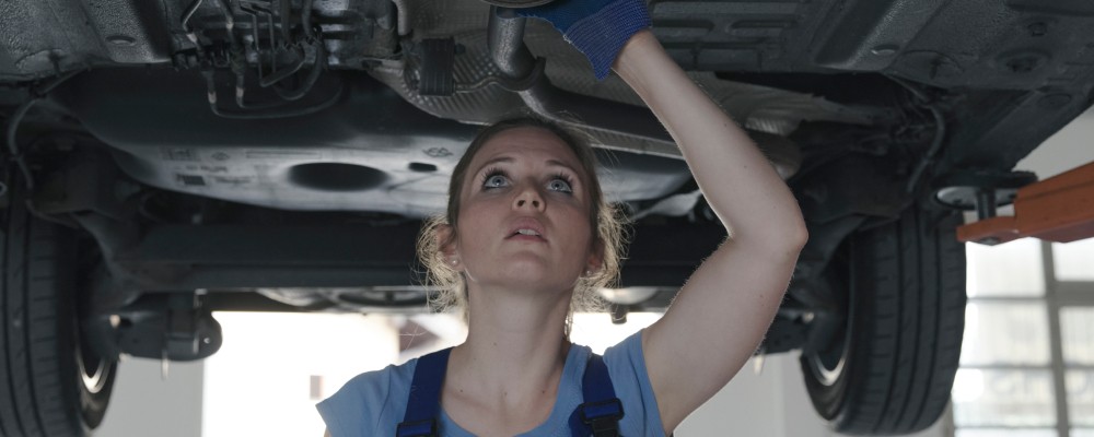 A working woman mechanic looking for alternator leaks, (speedalternators.com)